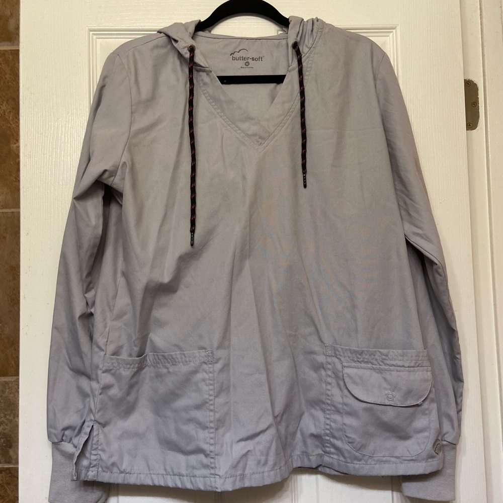 Womens grey v neck scrub jacket with hood. Great condition.